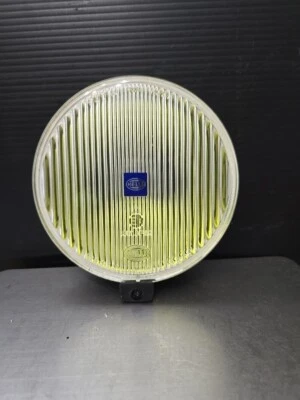 Lámpara de conducción Hella Comet 500 luz de punto amarillo con cubierta universal Foto 1 de 4