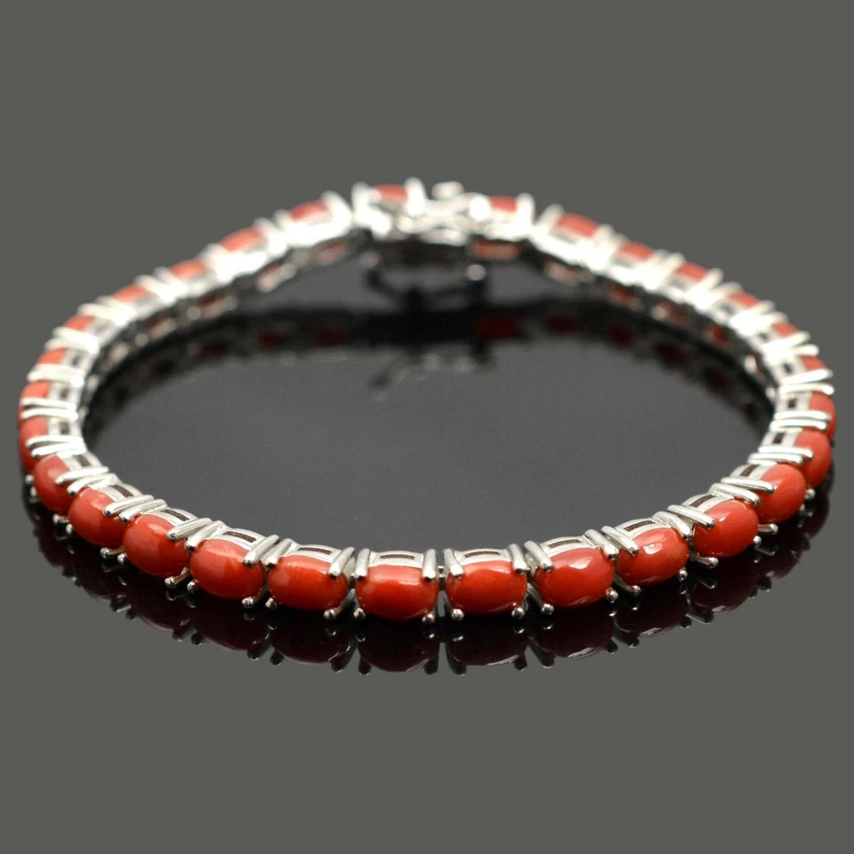 Brazalete de tenis de plata de ley 925 con piedras preciosas de coral creadas en laboratorio de corte ovalado de 9 quilates Foto 1 de 4