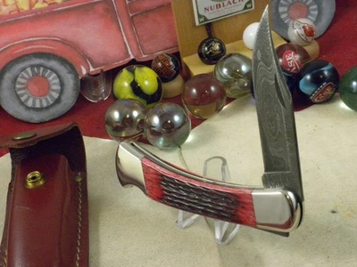 BUCK 110 USA CUCHILLO PLEGABLE DE CAZADOR MINT EN FUNDA ORIGINAL RED BONE DAMASCUS Foto 1 de 4