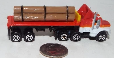 Small Micro Machine Semi Flat Bed Truck  in Red with a load of Logs - Image 1 of 4
