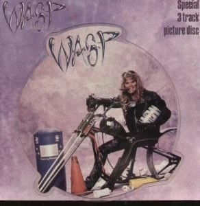 WASP MEAN MAN 7" VINYL 3 track limited edition shaped pic disc with backing card Foto 1 de 2