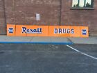 Vintage 1940s porcelain Rexall Drug sign with logos. Eight panels-25 feet wide