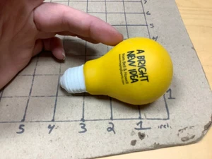 Squeezable Stress Reliever: LIGHT BULB - A bright new idea BELL & HOWELL - Picture 1 of 2