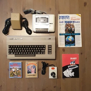 Commodore C64 Primo Modello + Alim + Reg + Joy + 2 Cassette Box - Test Ok - P1 - Foto 1 di 24
