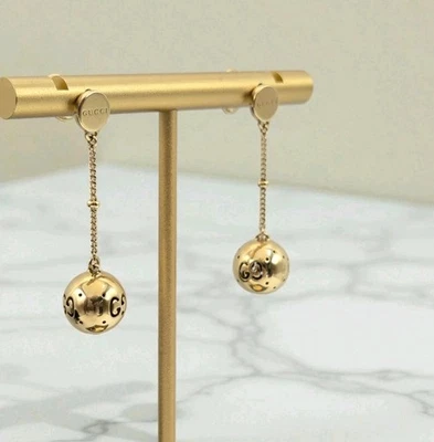 Pendientes colgantes Gucci de oro amarillo de 18k Boule GG Icon Foto 1 de 4