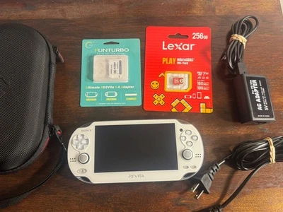 Sony PS Vita - PCH - 1000 OLED Blanco - Estuche, 256 GB + Adaptador de Almacenamiento + Cargador Foto 1 de 4