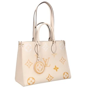 Louis Vuitton Size: MM M45717 On The Go Monogram Empreinte Creme Saffron 2 Way 9 - Picture 1 of 5