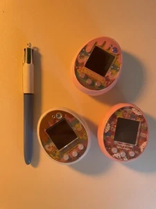 3 Tamagotchi Sanrio Meets : Sanrio +Pink + chocolate. Good Condition - Picture 1 of 7