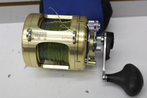 Mulinello da Pesca Shimano Tiagra 16 Leve Drag RH Acqua Salata con Lenza - Foto 1 di 10