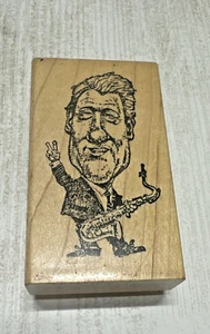 Bill Clinton Rubber Stamp Delafield Stamp Co holding saxophone unused president - Imagen 1 de 5