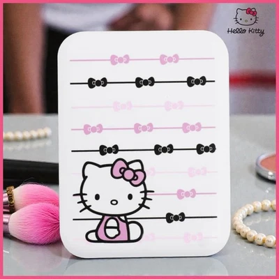 Mini espejo compacto de viaje Hello Kitty® "Ribbon" (IMPRESIONES) Foto 1 de 4