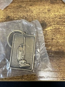 Llavero vintage Kirby barredora de vacío premio de ventas NUEVO SELLADO DE FÁBRICA - Imagen 1 de 4