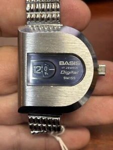 Orologio vintage raro svizzero BASIS digitale JUMP HOUR cassa a forma di D carica necessita di assistenza - Foto 1 di 7