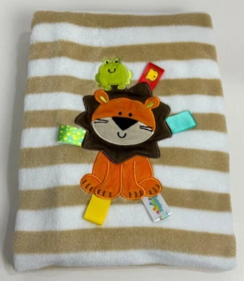 Плюшевое детское одеяло Taggies Tags желтовато-коричневое с коричневыми и белыми полосатыми полосками лев лягушка - Изображение 1 из 4