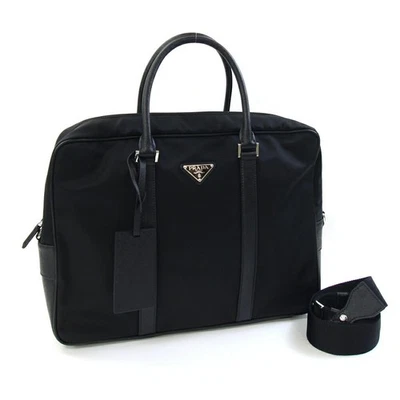 Maletín bidireccional Prada 2VE661 de segunda mano en nailon negro y cuero. Perfecto como a Foto 1 de 4