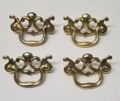 Cuatro tiradores de cajón de metal dorado de 3" Foto 1 de 4
