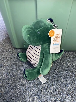 Peluche Carters Just One You Musical Dinosaurio Verde Peluche Rayas Azules Foto 1 de 4