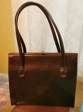 LOVELY BRONZE PATENT 1950S 1960S EROS HANDBAG WITH SUEDE LINING AND GOLD CLASP