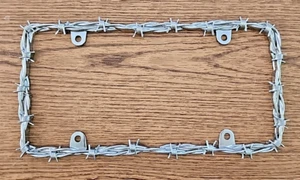 Bell Automotive 22-1-46144-8 Universal Barbed Wire Design License Plate Frame - Picture 1 of 2