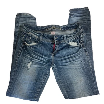 Pantalones de mezclilla azules elásticos desgastados lavado oscuro casi famosos talla 5 entrepierna 31 Foto 1 de 4