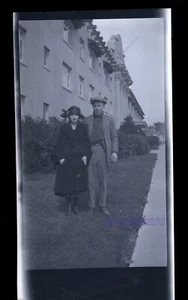 BLACK & WHITE NEGATIVE * 1920"s? man and woman next to building both wearing hat - Picture 1 of 3