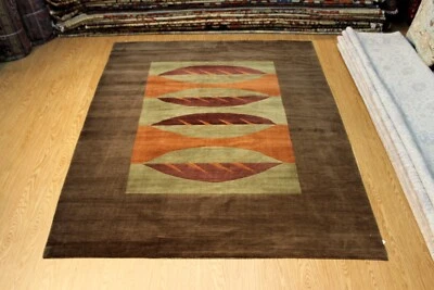 _HAND-MADE_KNOTTED_ 7' x 9' Wool Tibetan Rug brown, green, Salmon color - Image 1 of 4