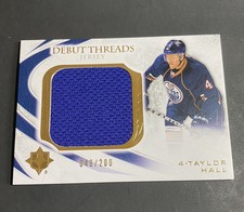 Taylor Hall  2010-11 Ultimate Collection - Debut Threads Jersey #'d 049/200 