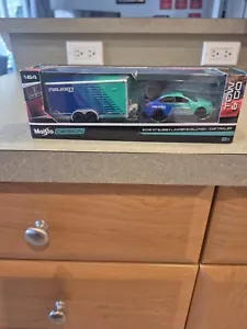 Remolque para carros y Mitsubishi Lancer Evolution 2008 Maisto 1:64 colores Falken - Imagen 1 de 5