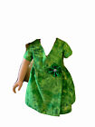 A brushed emerald green 18" doll dress that crosses in front and exudes elegance