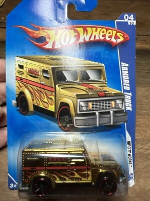 Hot Wheels Furgoneta Blindada 2009 4 de 10 City Works Oro con llamas y líneas rojas Foto 1 de 4