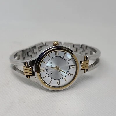 Reloj pulsera Anne Klein redondo dos tonos esfera plateada eslabón AK/1441-necesita batería Foto 1 de 4