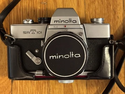 Minolta SRT101 SLR Camera With Case, Accessories, 2 Lenses 55mm & 135mm, Manuals - Image 1 of 4