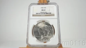 1924 US MINT 90% ARGENTO DOLLARO DELLA PACE $1 MONETA ROTONDA NGC CLASSIFICATO MS63 - Foto 1 di 4
