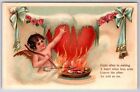Valentine~Cupid Melting Heart Over Fire~Leaves Other Cold as Ice~Emboss~c1910