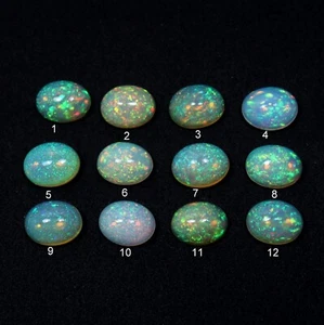 7x9 mm Natural Superior Grado Arco Iris Pin Fuego Ópalo Etíope Ovalado Cabujón Al Por Mayor - Imagen 1 de 9