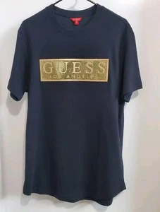 Camisa para hombre Guess Los Angeles negra dorada con logotipo grueso acanalado algodón lentejuelas talla L - Imagen 1 de 8