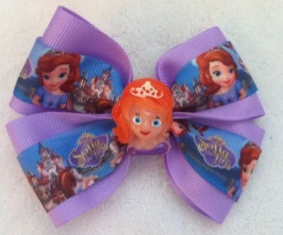 Moño de pelo para niñas de 4" de ancho Sofía la primera cinta púrpura grosgrain clip de cocodrilo Foto 1 de 4