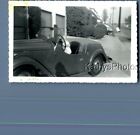 FOUND B&W PHOTO K_0417 BABY SITTING IN OLD CAR