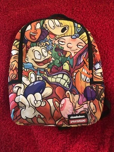 Sprayground x Nickelodeon Zaino Festa Anni 90 Edizione Limitata 💯 Autentico - Foto 1 di 7