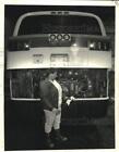 1987 Press Photo Pattye Paines Check Bus Oil at Maintenance Barn on Canal Street