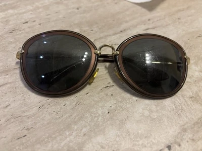 Gafas de sol redondas doradas Miu Miu SMU50R UFB 9L1 Foto 1 de 4