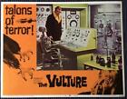 Robert Hutton as Dr. Eric Lutens looking at skeleton The Vulture lobby card 4027