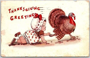 1913 Thanksgiving Greetings Baby Crawling Touch Feet Of Turkey Posted Postcard - Picture 1 of 2