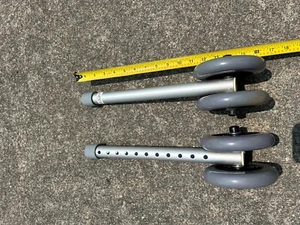 PAIR OF INVACARE WALKER LEG EXTENSIONS WITH WHEELS - Picture 1 of 1