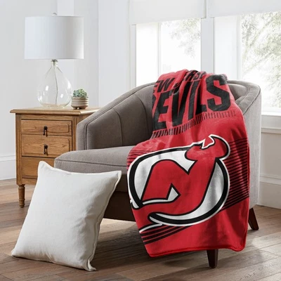 Manta Raschel 60" x 80" con licencia oficial de la NHL New Jersey Devils Foto 1 de 4