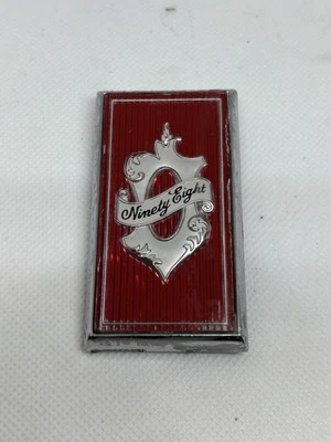 Oldsmobile Ninety Eight 98 1978-82 cerradura maletero emblema pieza superior Foto 1 de 4