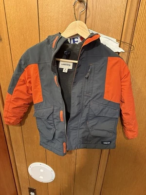 Abrigo de invierno con capucha para niños de segunda mano. Talla M 5-6. Naranja y gris. Usado Bueno Foto 1 de 4