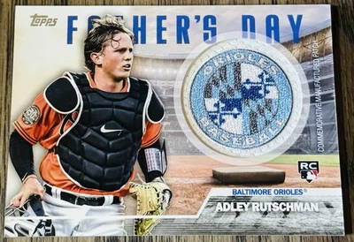 2023 Topps Commemorative Fathers Day Team Patch Adley Rutschman RC Orioles - Image 1 of 2