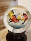 Vintage glass ball that spins with stand with Horses
