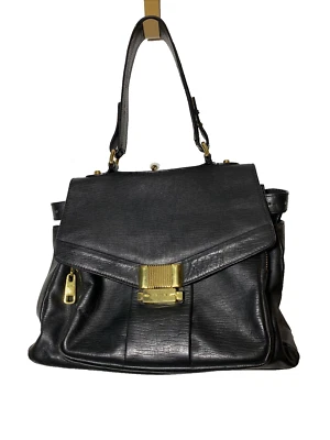 Bolso de mano/bolso de hombro de cuero negro de dos texturas TRINA TURK forrado con herrajes dorados Foto 1 de 4